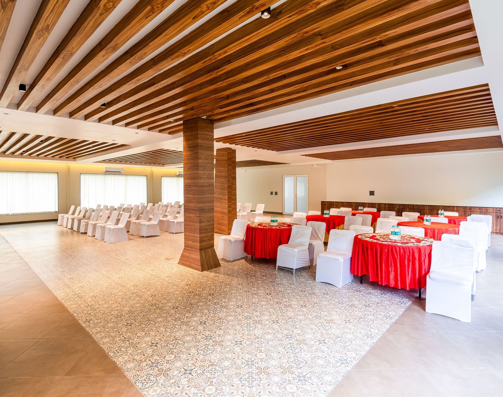 Banquet Hall at DLS Divine River Resort and Spa featuring  chairs table and a stage